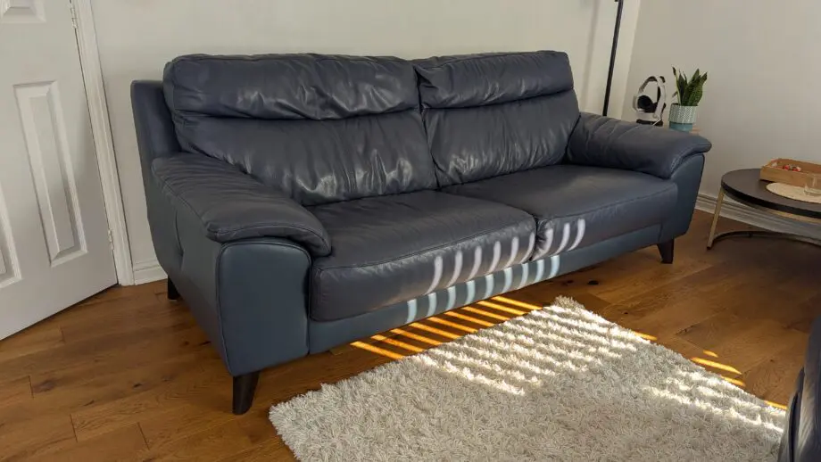 DFS leather 3 seater sofa and footstool denim blue