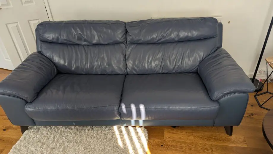 DFS leather 3 seater sofa and footstool denim blue