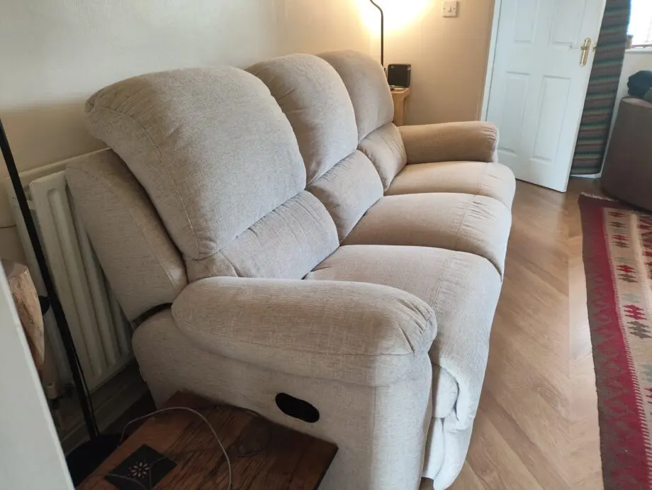 Cream 3 seater recliner sofa.