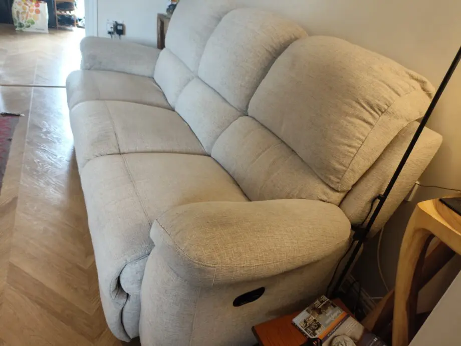 Cream 3 seater recliner sofa.