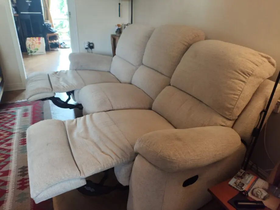 Cream 3 seater recliner sofa.