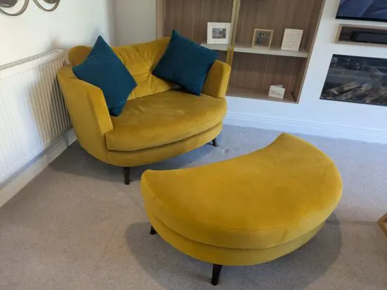 Stunning Velvet Love Seat with matching footstool by Lucas Furniture