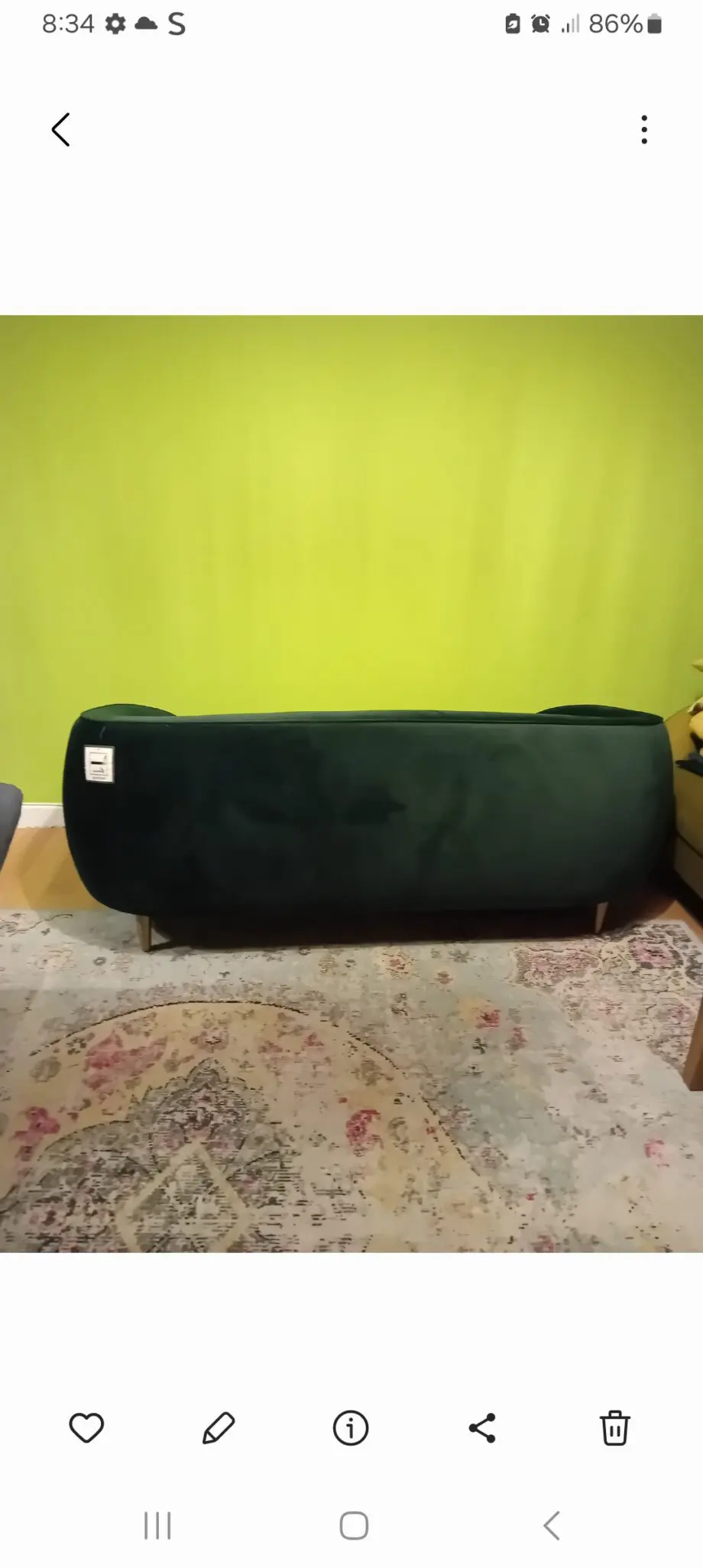 Made dark green sofa
