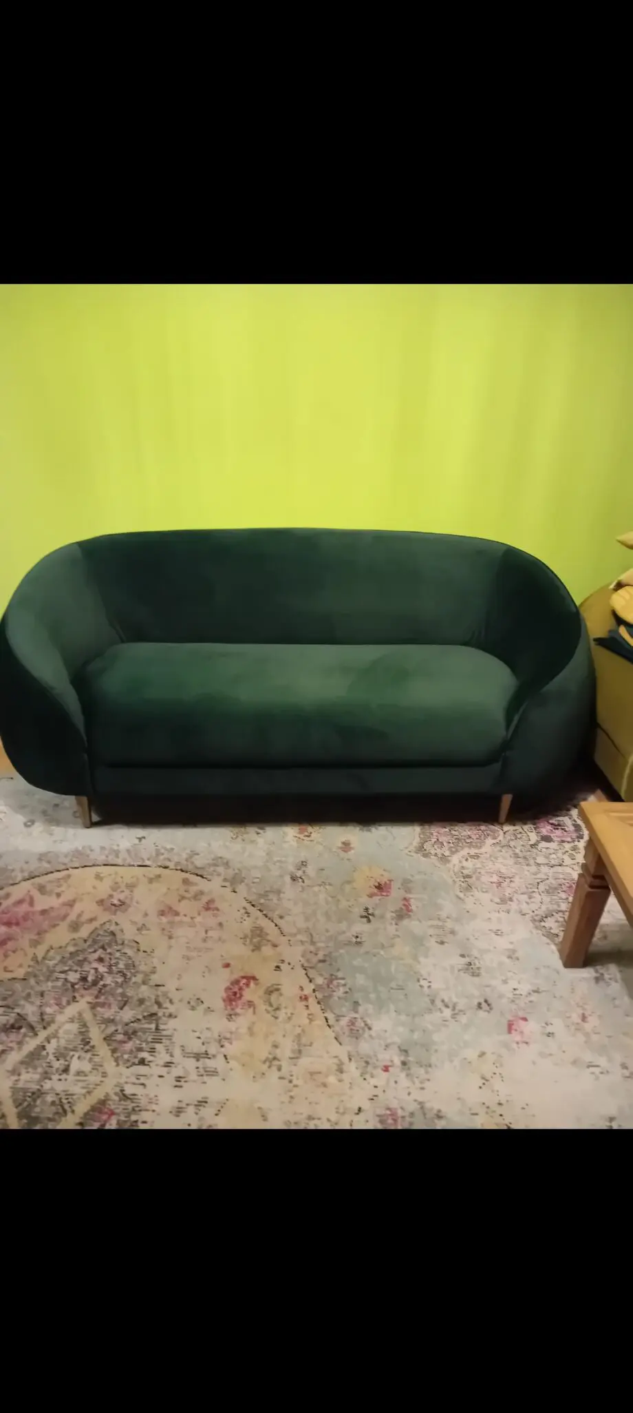 Made dark green sofa