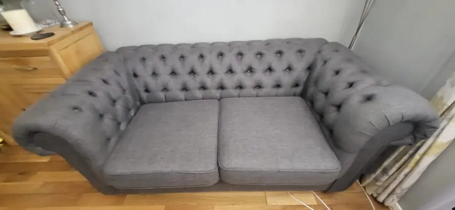 Grey fabric Chesterfield style sofas