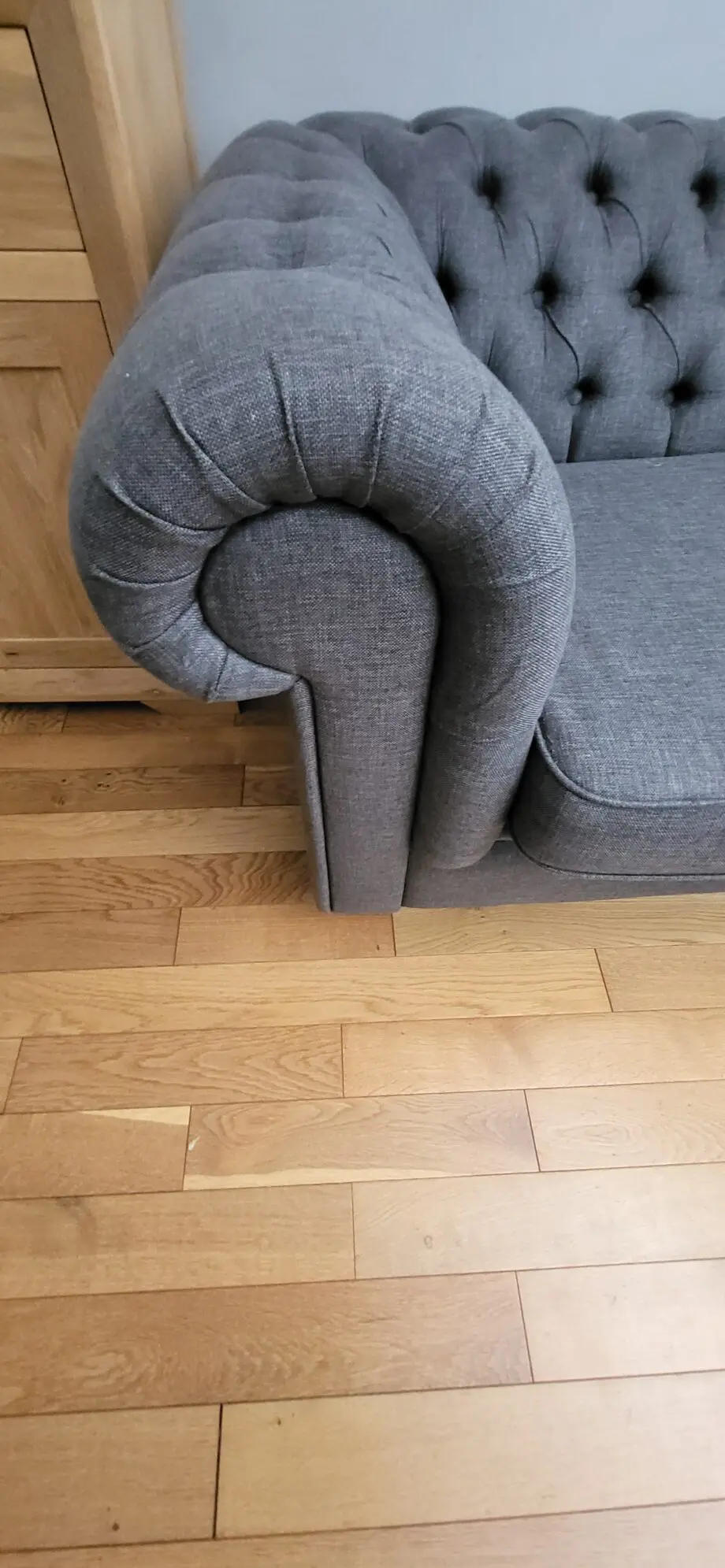 Grey fabric Chesterfield style sofas
