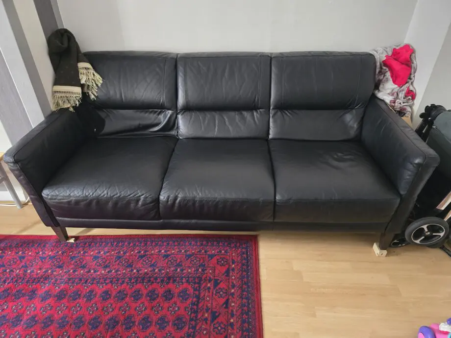 DFS black leather 3 and 2 seater sofas