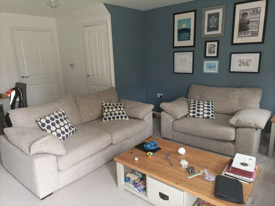 2 piece suite in grey: One large armchair+ 2 seat couch