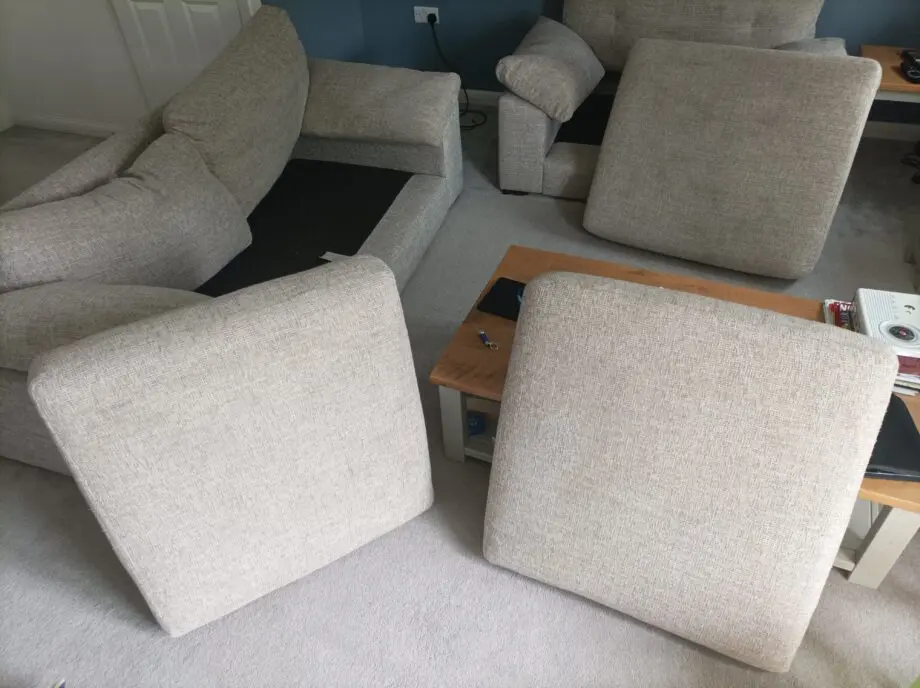 2 piece suite in grey: One large armchair+ 2 seat couch