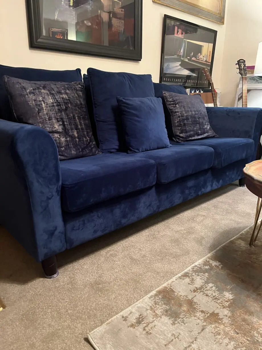 Nice Blue velvet three seat sofa , hardly used so in very good condition