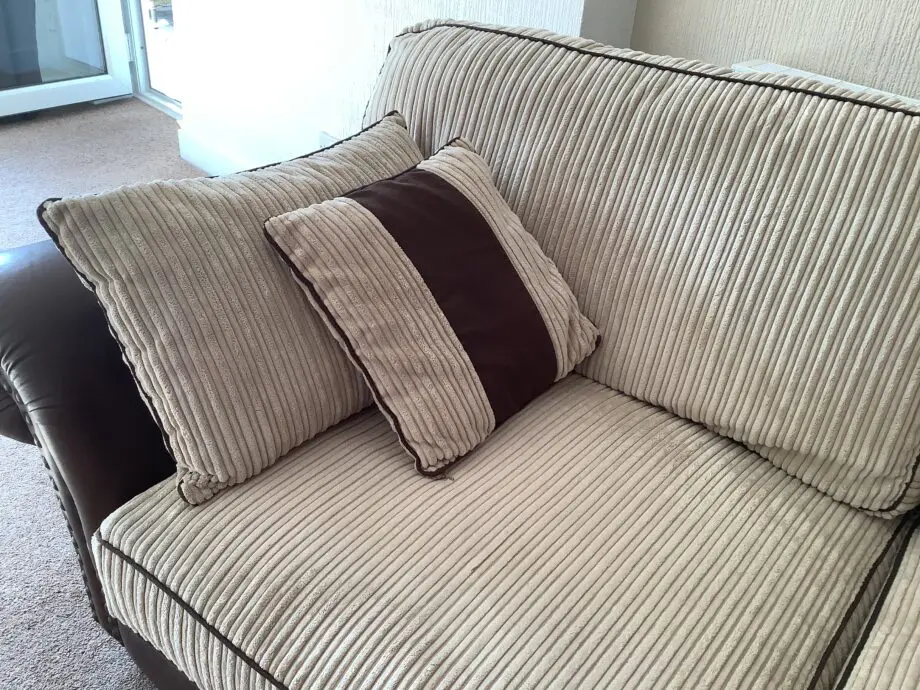 Brown Leather & Fabric Sofa with Soft Cream Cushions