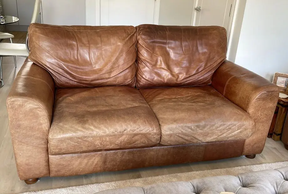 Vintage leather sofa x2 (TImothy Oulton Halo) and footstool