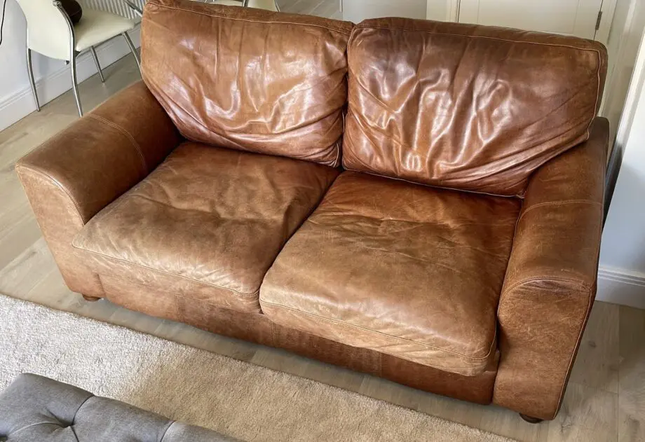 Vintage leather sofa x2 (TImothy Oulton Halo) and footstool