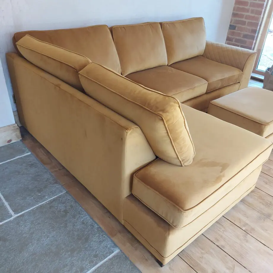 DFS Corner Sofa in velvet cinnamon & storage footstool