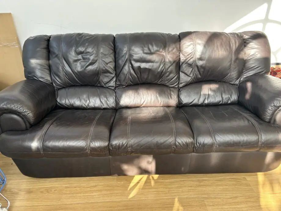 Brown faux leather sofa