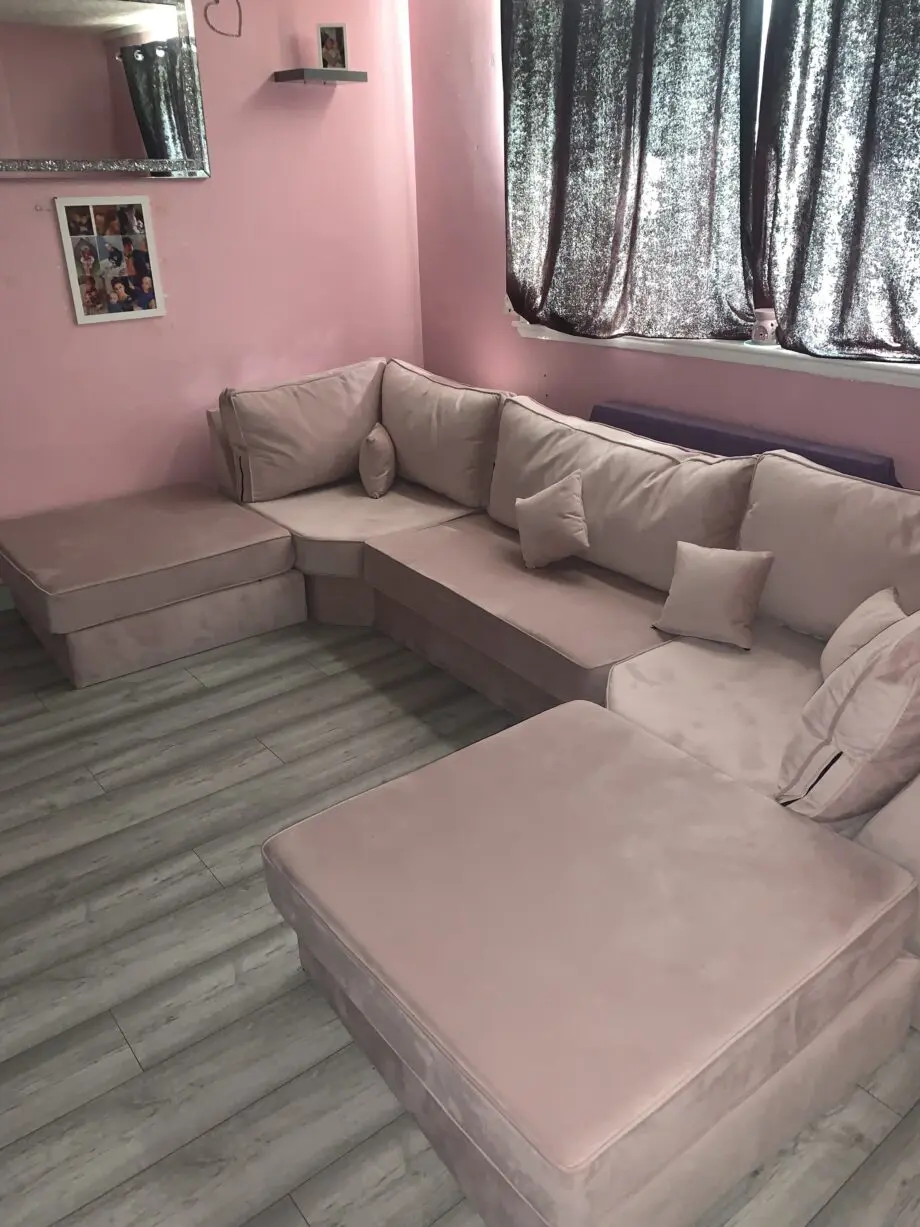 Pink u shape sofa and other two large foot rests