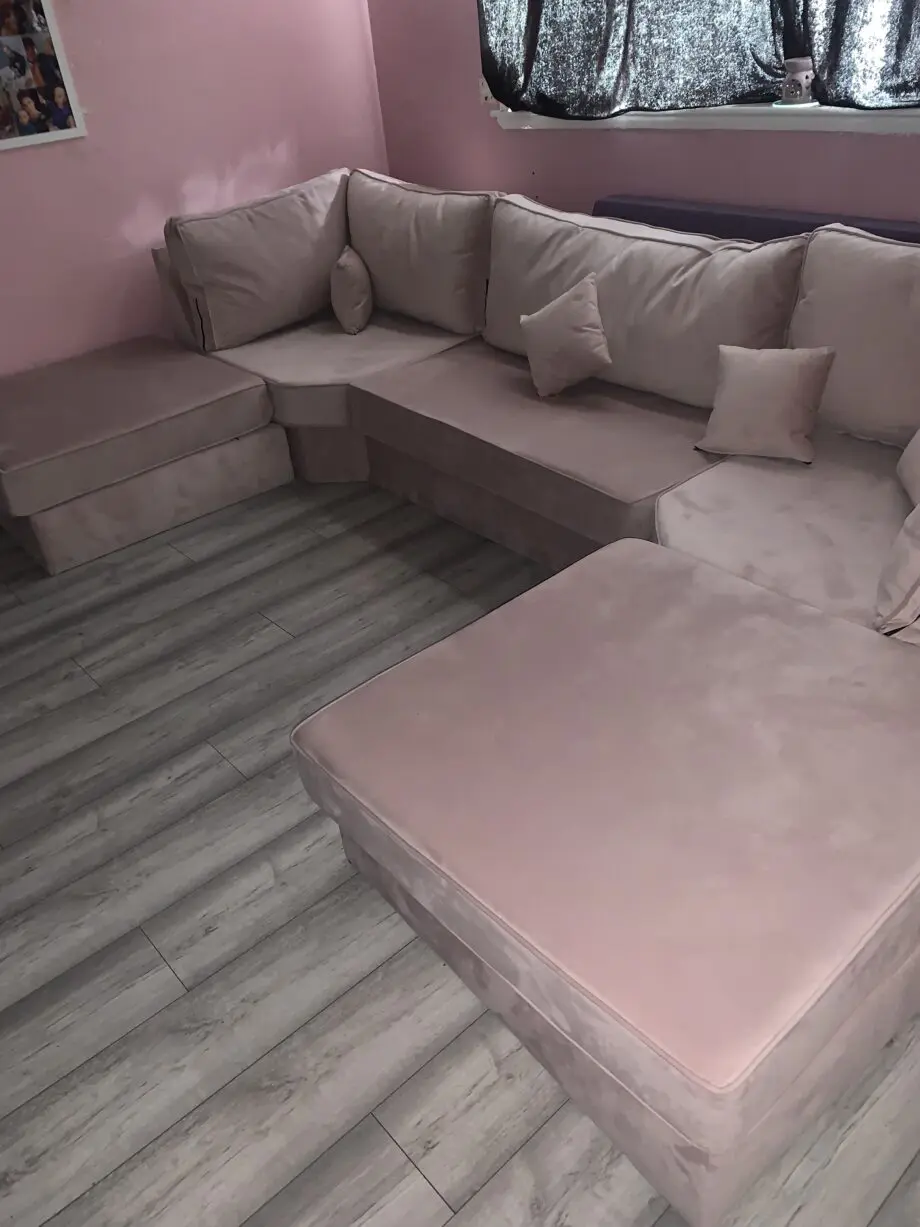 Pink u shape sofa and other two large foot rests