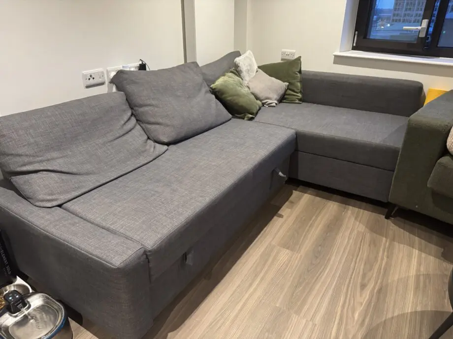 Dark grey Friheten sofa-bed with storage