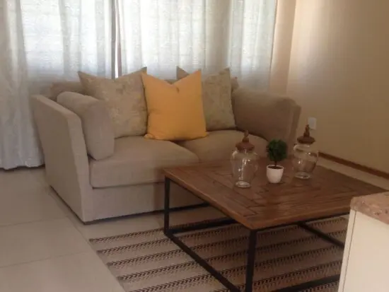 Beige 2 seater couch