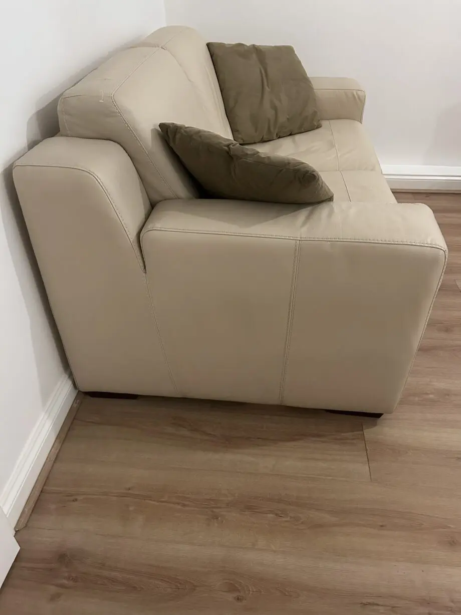 DFS cream two seater leather sofa