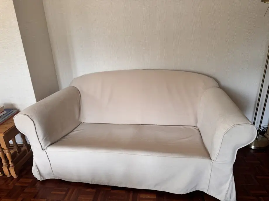 Beige/cream fabric 2-seater sofa