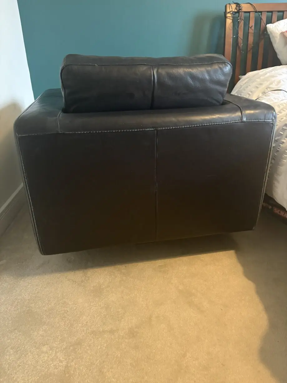 Black soft leather Natuzzi 2 x 2 seater sofa and a matching swivel chair