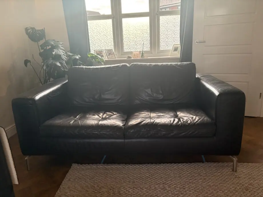 Black soft leather Natuzzi 2 x 2 seater sofa and a matching swivel chair