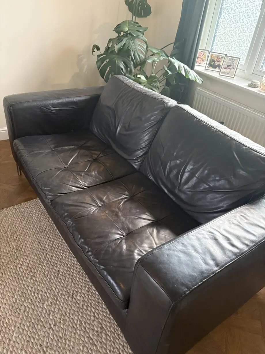 Black soft leather Natuzzi 2 x 2 seater sofa and a matching swivel chair
