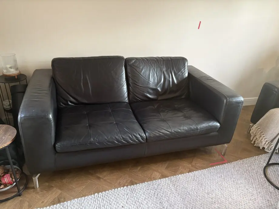 Black soft leather Natuzzi 2 x 2 seater sofa and a matching swivel chair