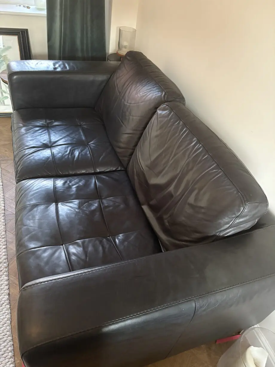 Black soft leather Natuzzi 2 x 2 seater sofa and a matching swivel chair