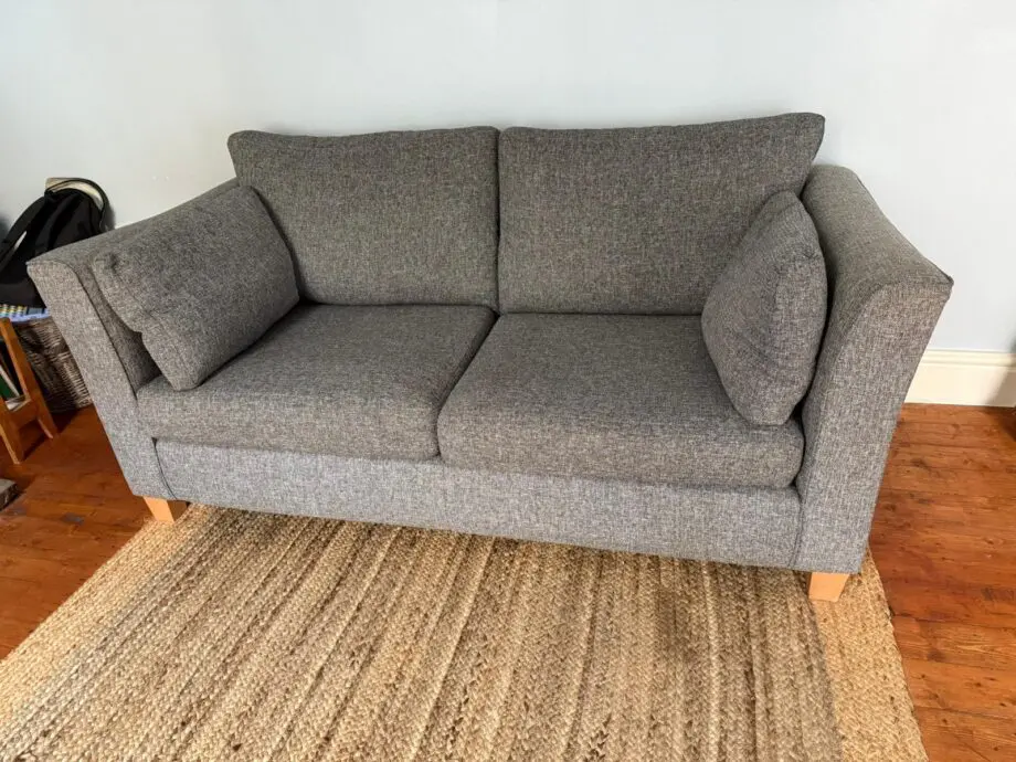 Marks & Spencer’s grey fabric 2 seater sofa. Bought brand new 3 years ago.