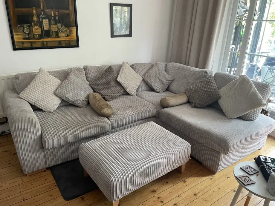 Corner sofa with foot stool