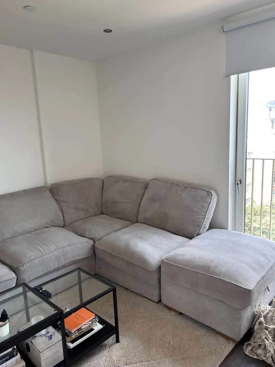 Grey L shaped sofa with Ottoman