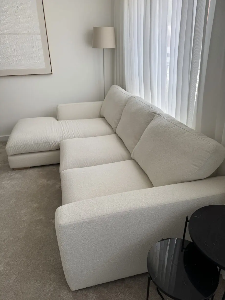 DFS Calix 3 seater sofa with chaise long in ivory boucle with matching footstool