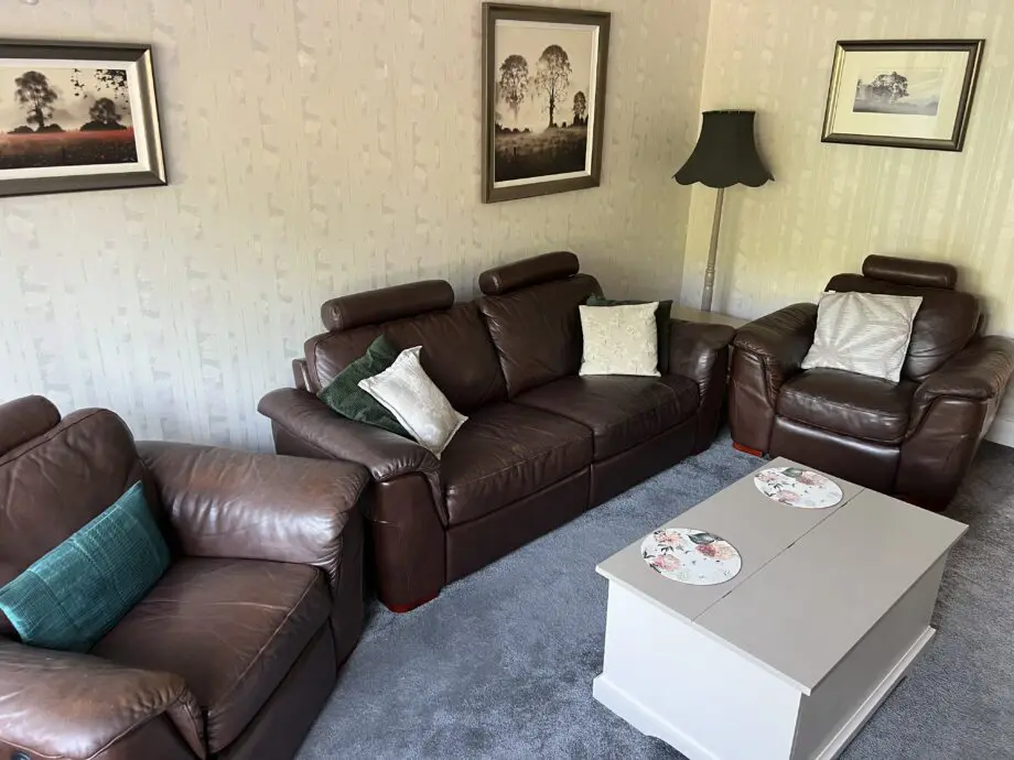 Real leather three piece sofa set.
