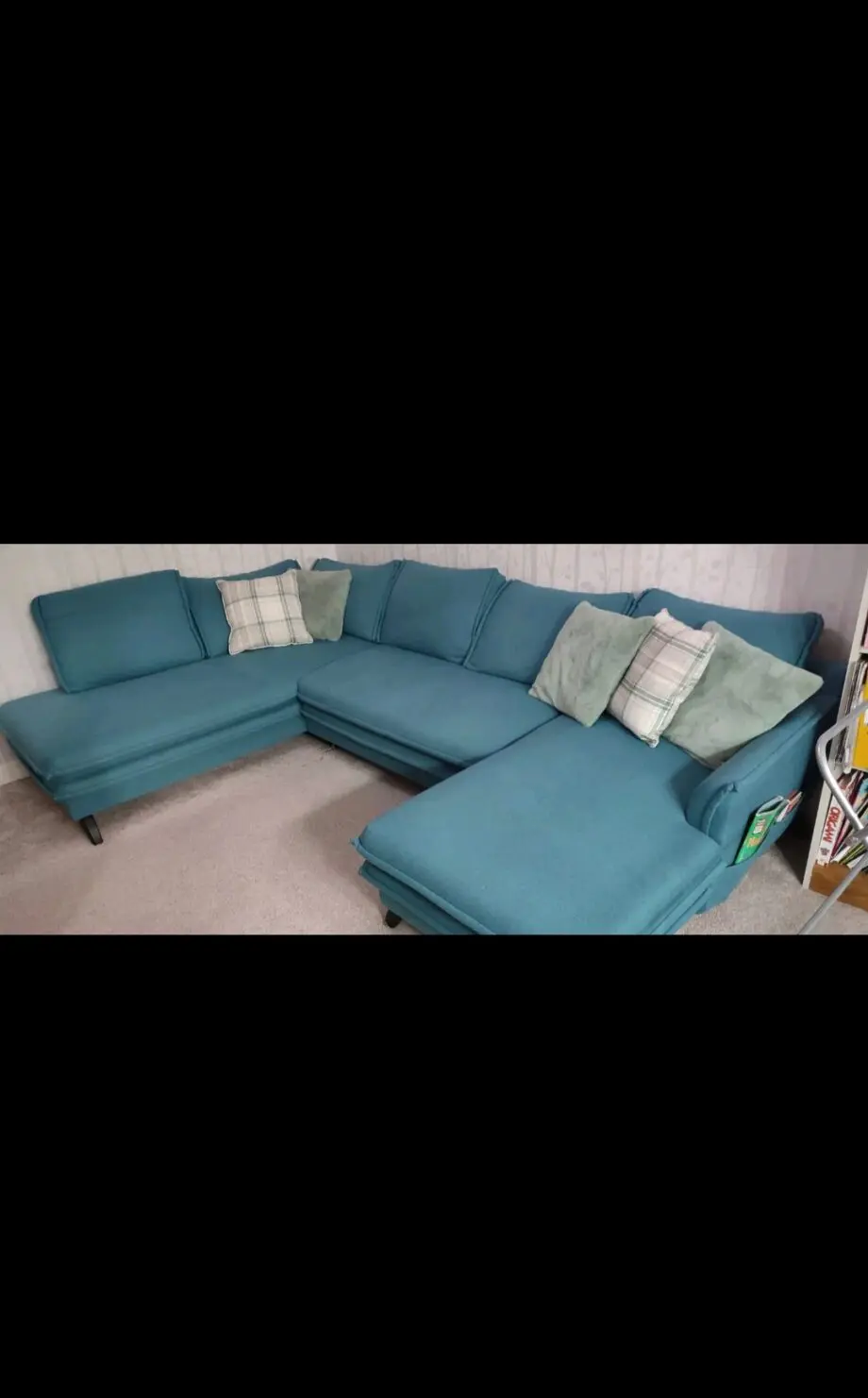 Green corner sofa bed with large storage