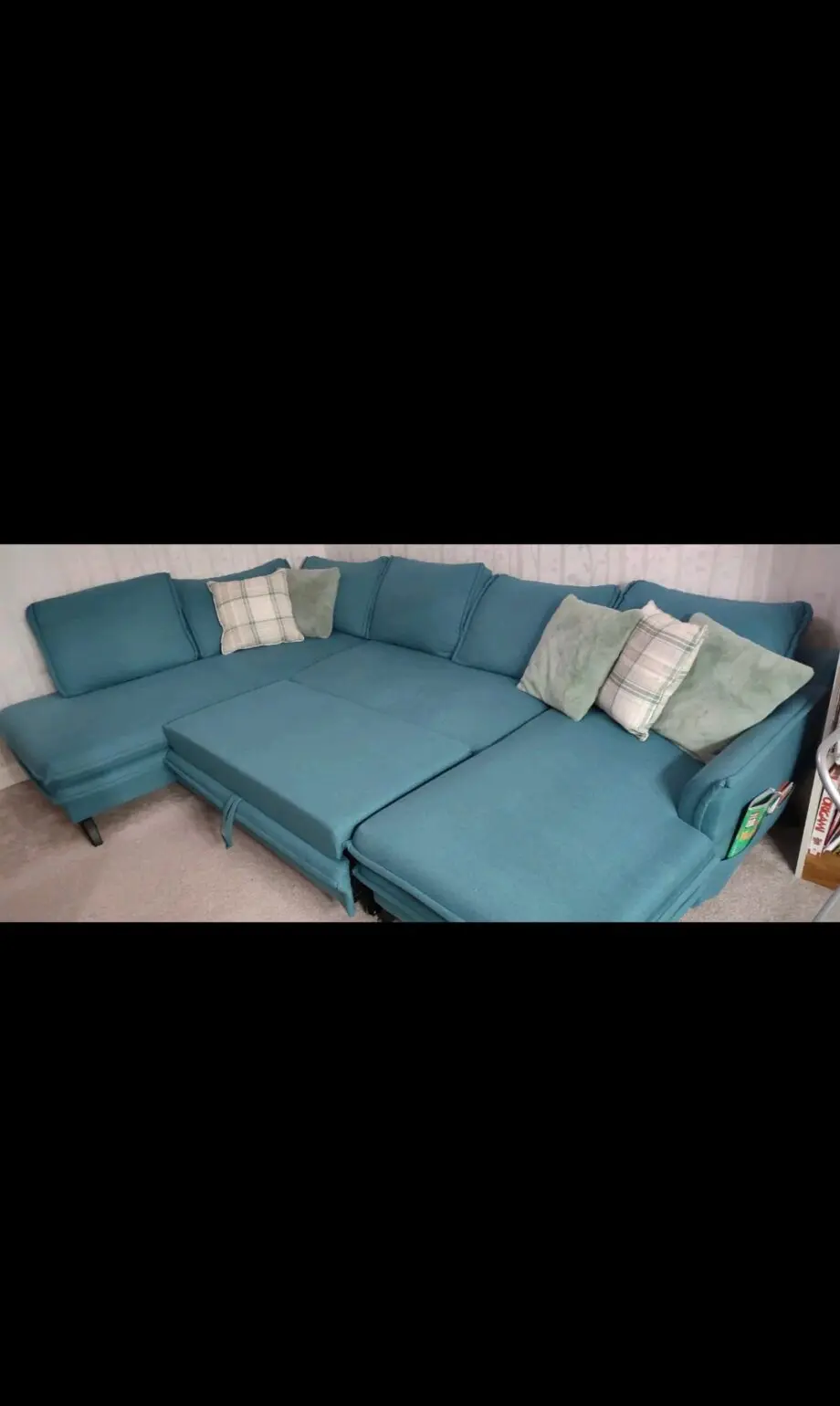 Green corner sofa bed with large storage