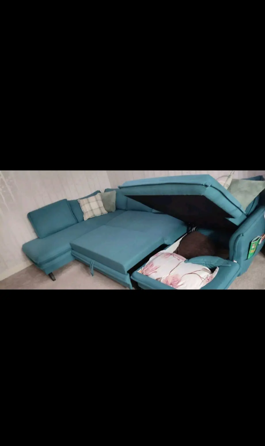 Green corner sofa bed with large storage