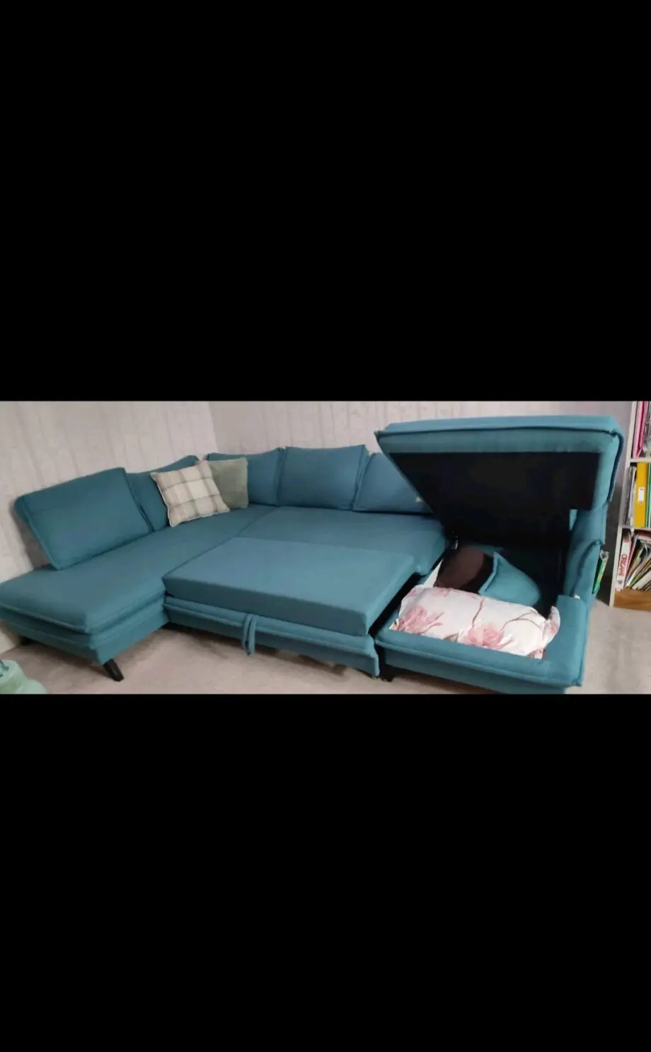 Green corner sofa bed with large storage