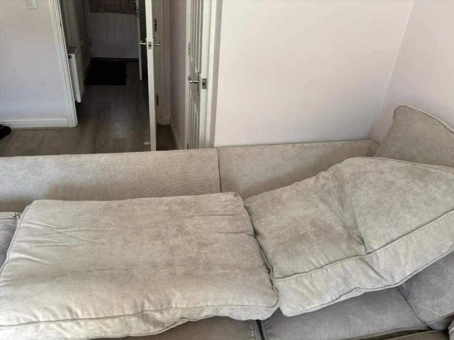 DFS oatmeal corner sofa and foot stool
