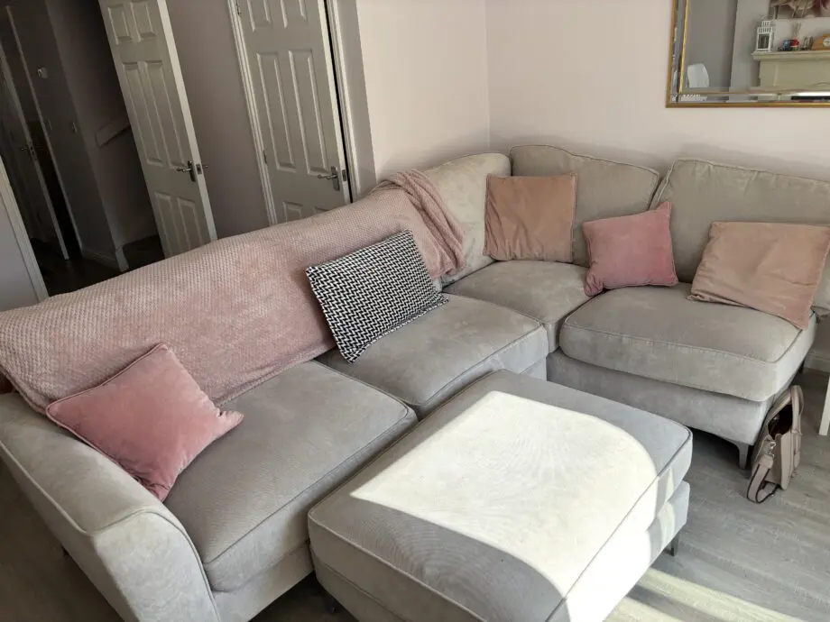DFS oatmeal corner sofa and foot stool