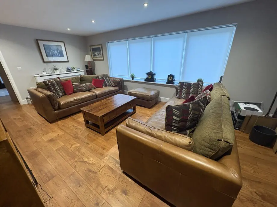 Leather sofas and footstool - furniture village