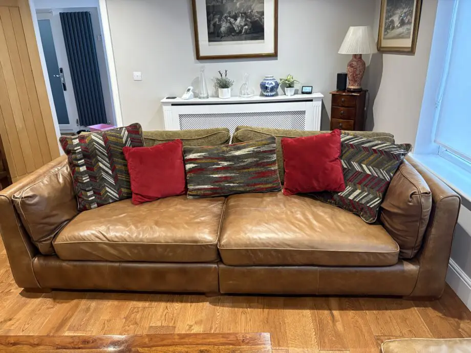 Leather sofas and footstool - furniture village