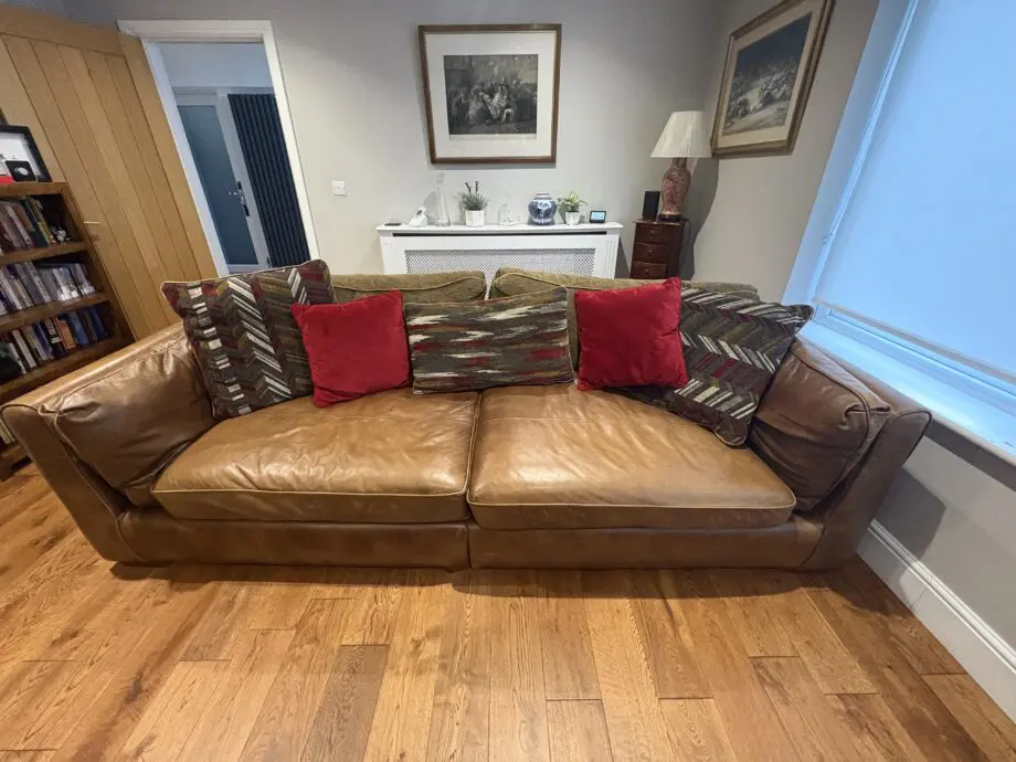 Leather sofas and footstool - furniture village