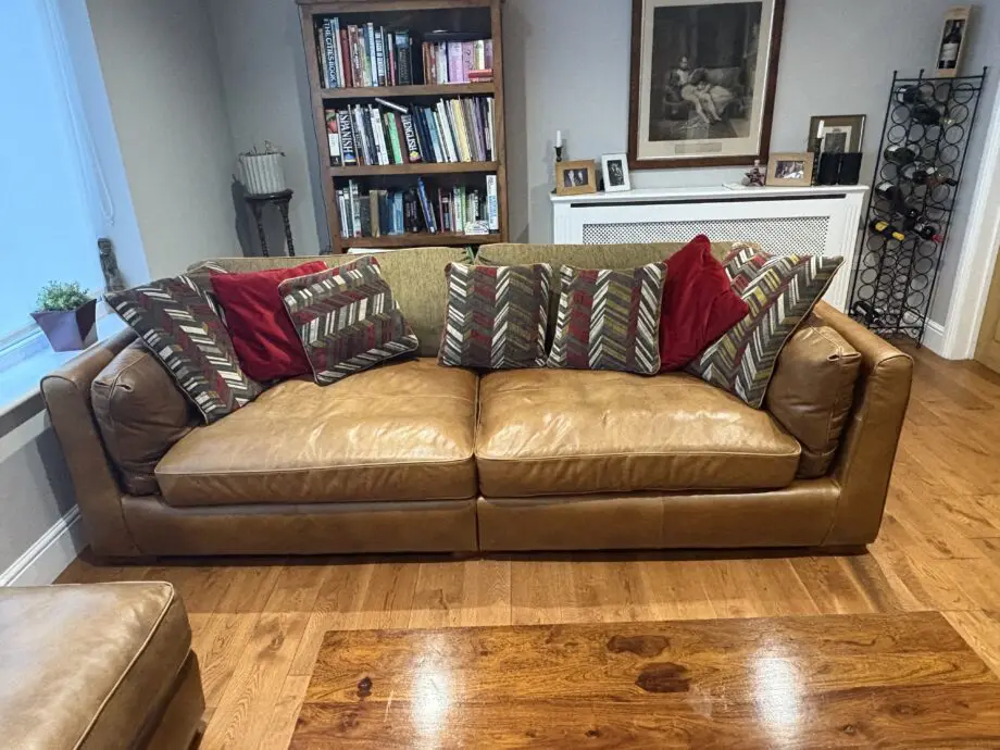 Leather sofas and footstool - furniture village