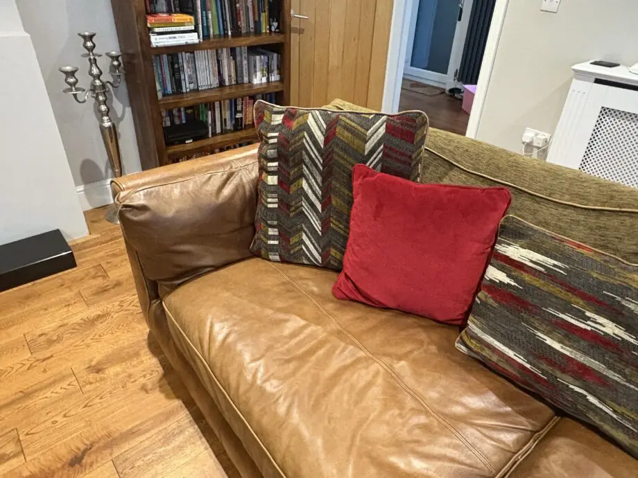 Leather sofas and footstool - furniture village