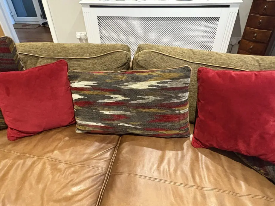 Leather sofas and footstool - furniture village
