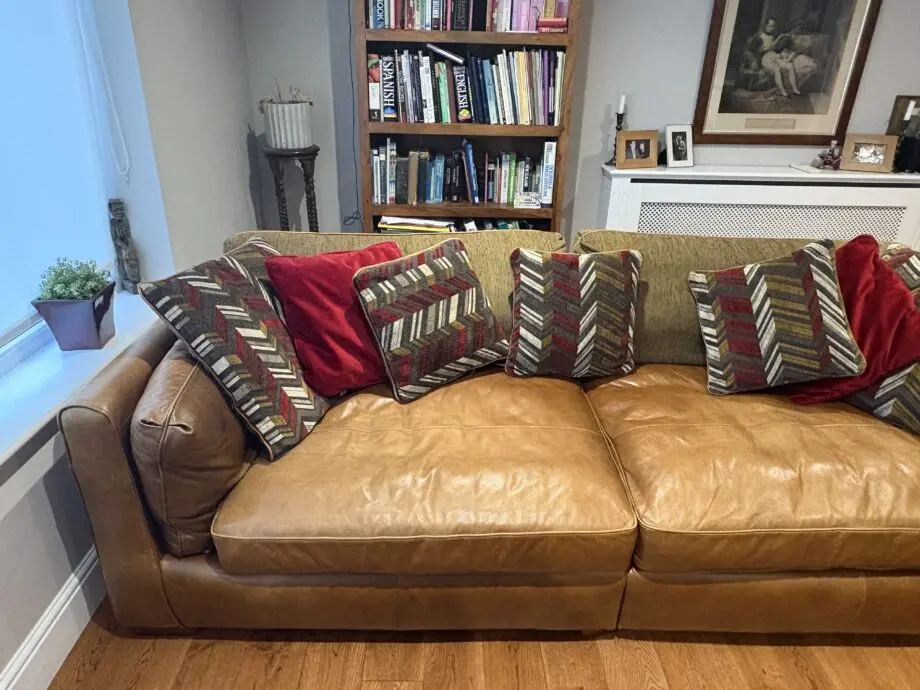 Leather sofas and footstool - furniture village
