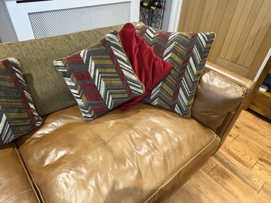 Leather sofas and footstool - furniture village