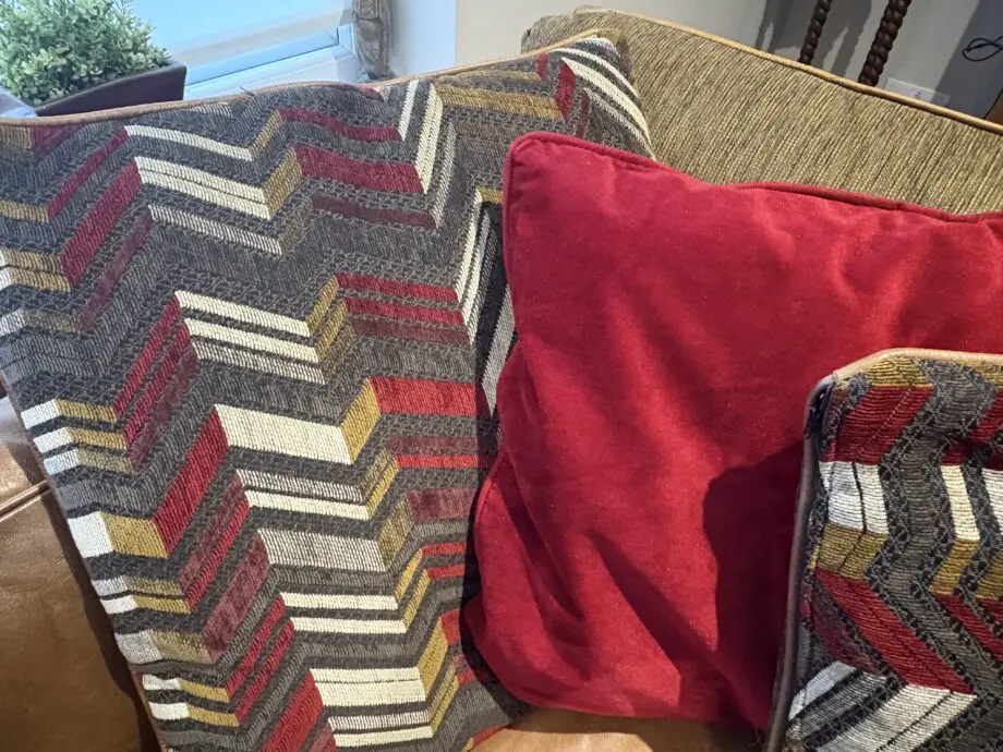 Leather sofas and footstool - furniture village